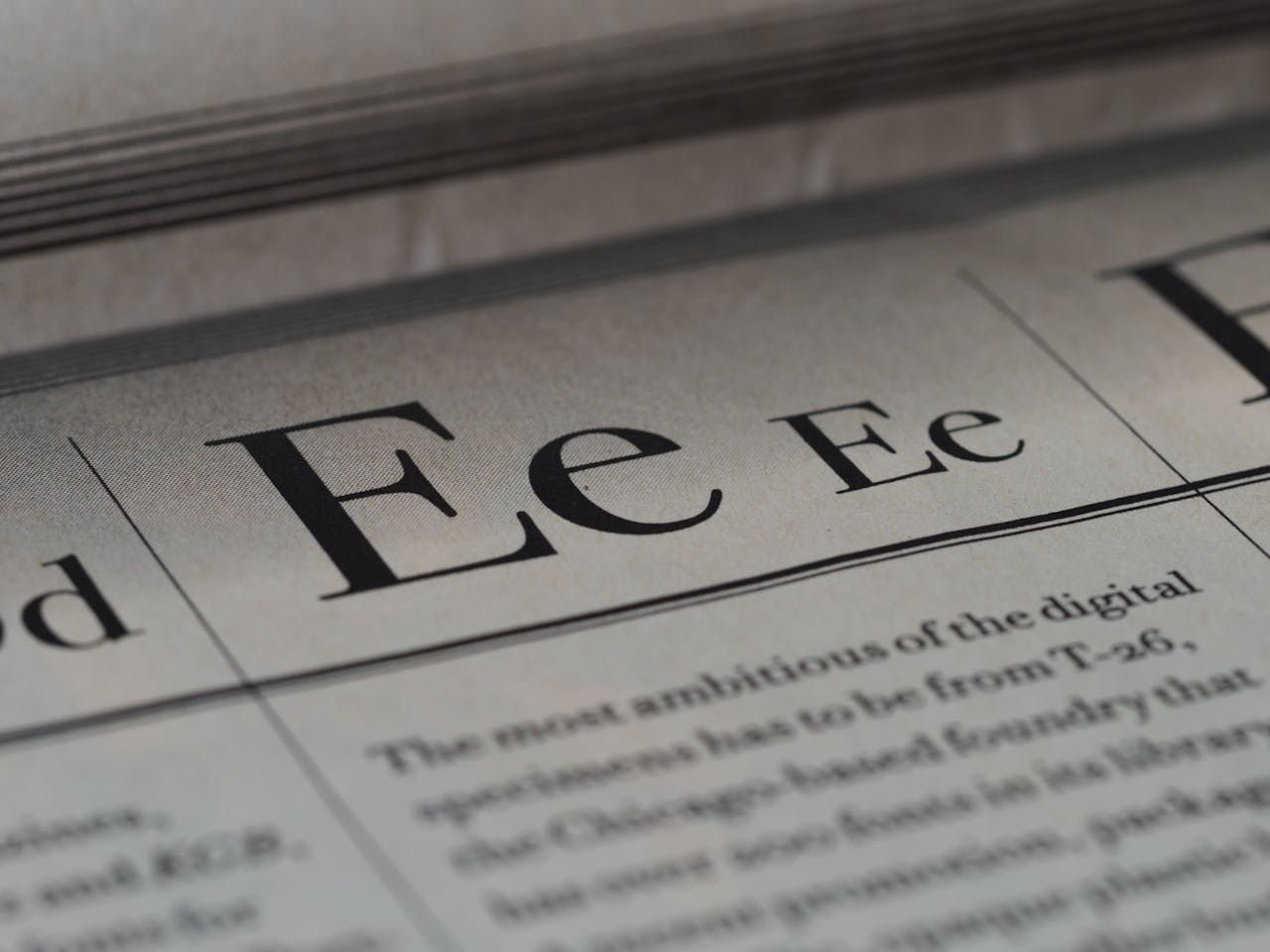 Artistic close-up of typography on newspaper with selective focus.